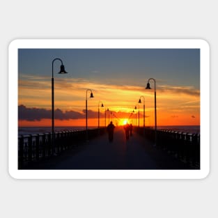 The pier at sunset Sticker